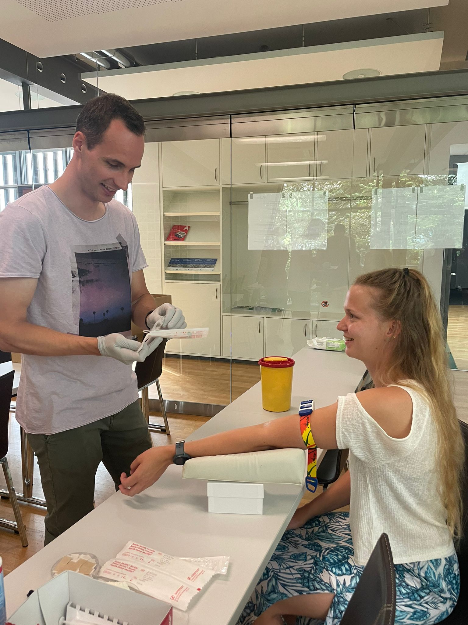 Two students preparing for blood donation.